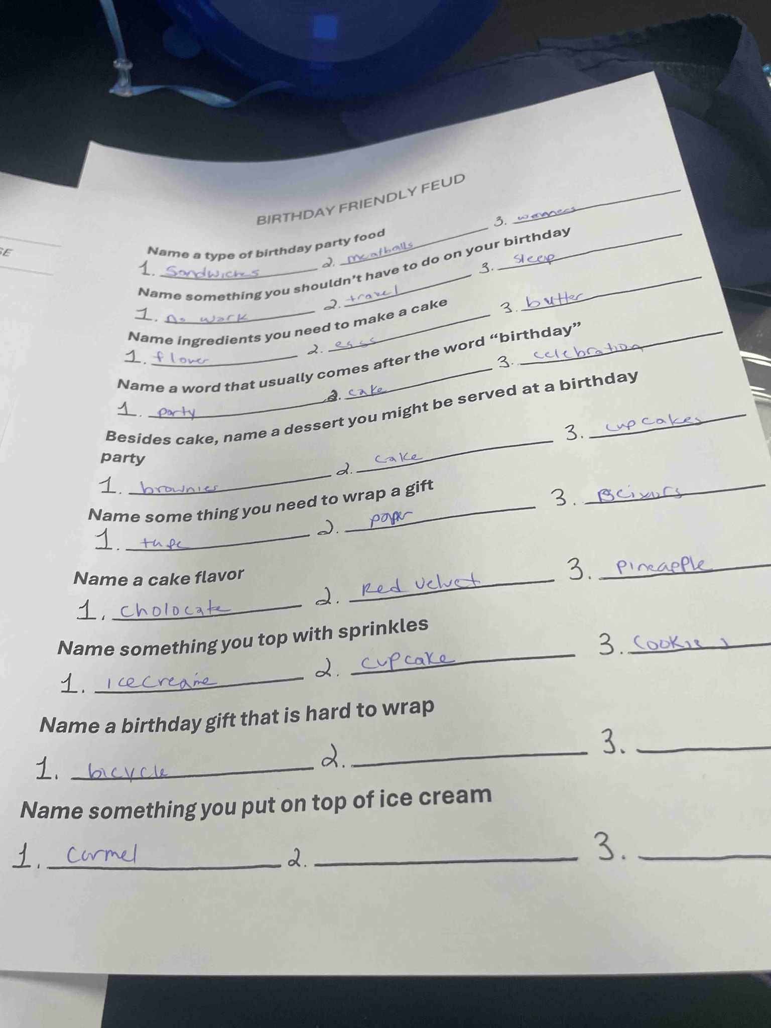 The image shows a 'Birthday Friendly Feud' game sheet with various prompts asking for lists of common birthday-related items, traditions, and ingredients. The goal is to provide three typical answers for each category, similar to the game show Family Feud.