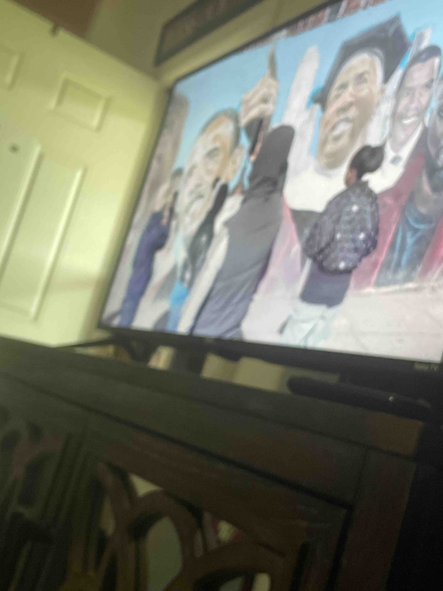 Identify the content displayed on the television screen in the image.