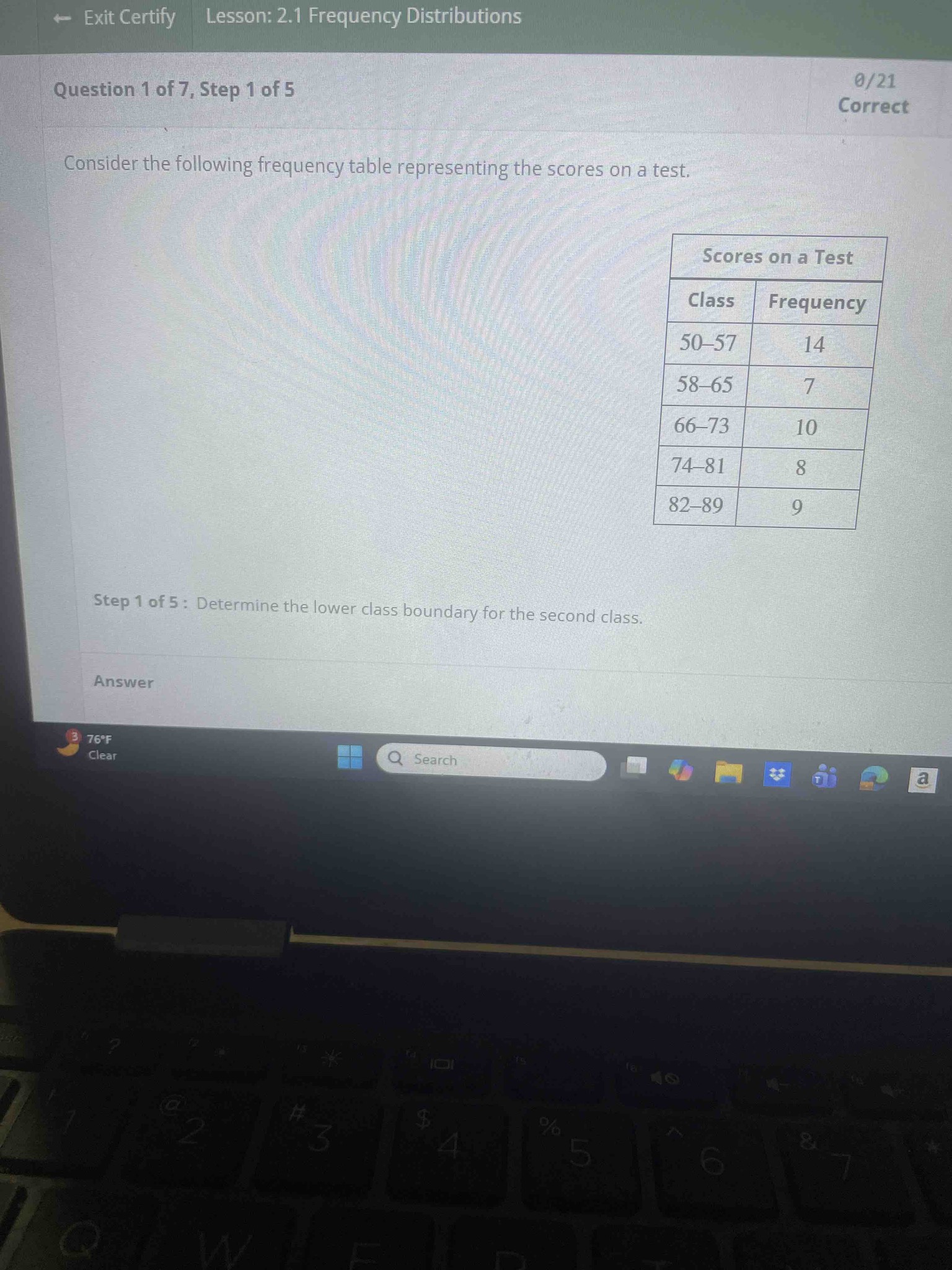 Consider the following frequency table representing the scores on a test. Determine the lower class boundary for the second class.