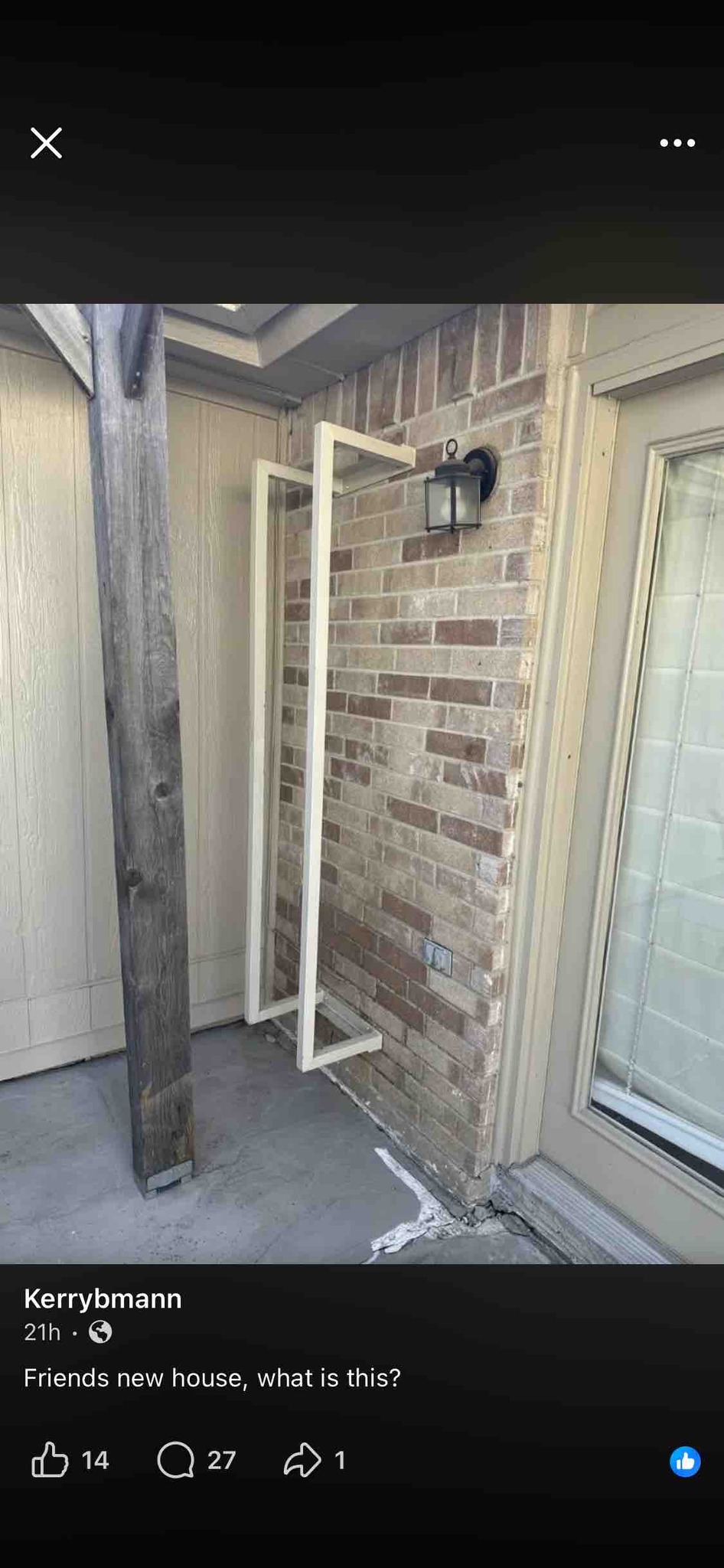 What is the metal structure mounted on the wall in the photo?